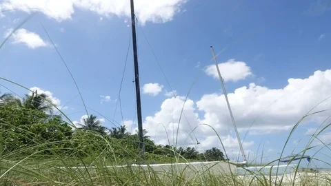 Time Lapse of Clouds Over Catamaran Видео 77064800