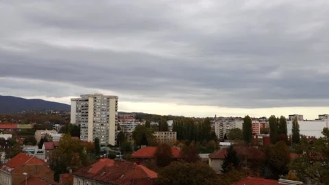 Time lapse clouds over the city Stock Footage 142137053