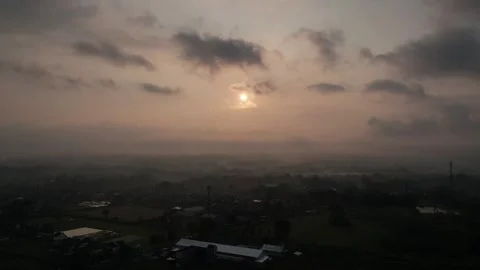 Time lapse of clouds over the city with a sunset atmosphere Stock Footage 261931530
