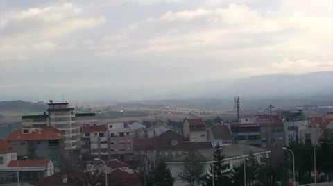 Time lapse of clouds over cityscape Braganza - slow pan left Stock Footage 37557239
