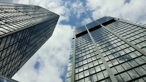 Time lapse of clouds over  corporate buildings 動画素材 76927101