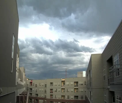 Time lapse of clouds over a courtyard Stock Footage 29897527