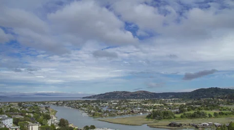 Time Lapse of clouds over creek and bay in the background 스톡 동영상 39788501
