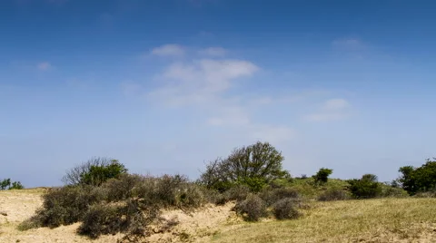 Time lapse of clouds over the dunes of Holland Video stock 40810634