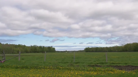 Time Lapse of clouds over farmers field Видео 34688561