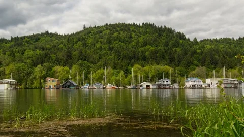 Time lapse of clouds over floating boathouses in Sauvie Island Portland Or 4k Stock Footage 75883090