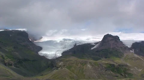 Time lapse clouds over glacier descending down mountains Stock Footage 37779181