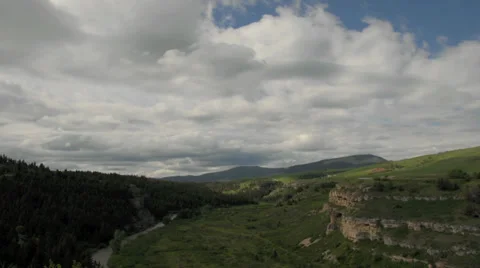 Time-lapse of clouds over a green valley in Montana, USA Stock Footage 29672313