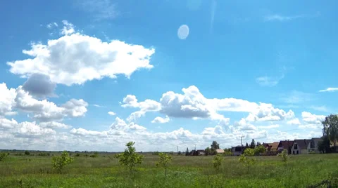 Time lapse of clouds over a green field Stock Footage 38938982