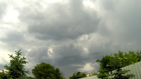 Time lapse of clouds over a green garden Stock Footage 38948953