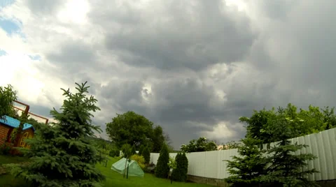 Time lapse of clouds over a green garden Stock Footage 38959314