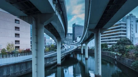 Time Lapse of clouds over highway and office buildings in Tokyo, Japan Stock Footage 145504333