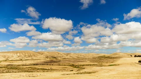Time-lapse clouds over hills in desert 스톡 동영상 93863325