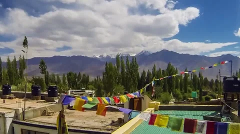 Time Lapse of Clouds over Himalayan Mountains and Prayer Flags Video stock 51807430