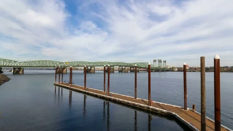 Time lapse of clouds over I-5 Portland Vancouver bridge traffic in WA and OR 4k Stock Footage 69779010