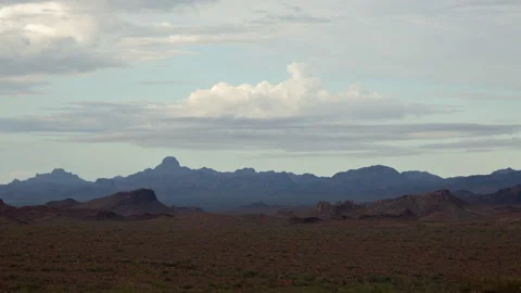 Time lapse of clouds over jagged mountains and hills in the Sonoran Desert Stock Footage 158454231