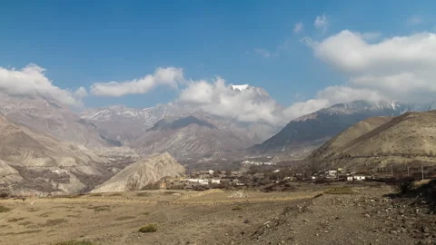 Time lapse of clouds over Kagbeni and the mountains in the Nepal himalayas Video stock 258425798