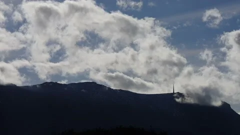 Time-lapse of clouds over kunanyi / Mount Wellington on a sunny day Stock Footage 159122719