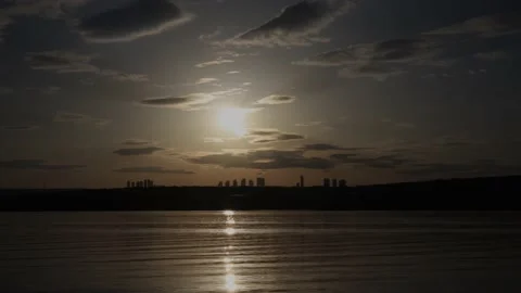 Time-lapse clouds over the lake at sunset Stock Footage 180171427