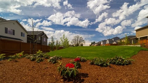 Time lapse of clouds over luxury homes in Happy Valley Oregon one sunny day 4k Stock Footage 75457682