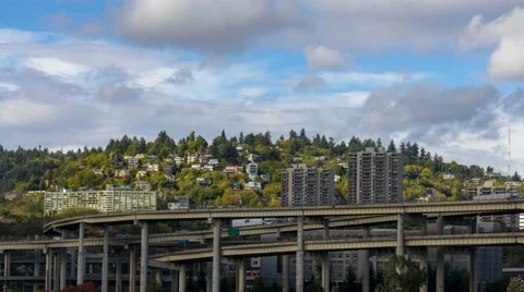 Time lapse of clouds over Marquam bridge with homes on hillside in Portland OR Stock Footage 68105016