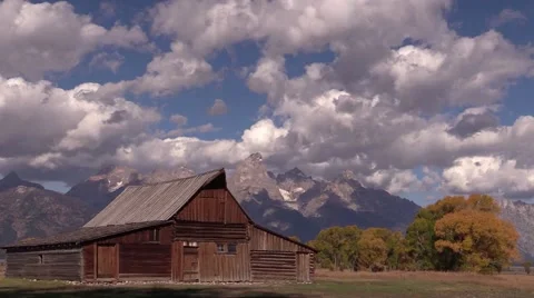 Time lapse clouds over mormon row farmhouse Stock Footage 42882058