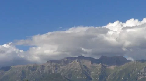 Time Lapse of Clouds Over a Mountain Against a Blue Sky Stock Footage 53292652