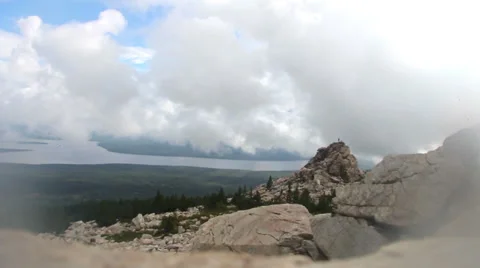 Time lapse of clouds over mountain peak Stock Footage 61404415