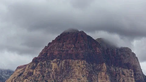 Time Lapse of Clouds Over a Mountain Peak Stock Footage 107946377