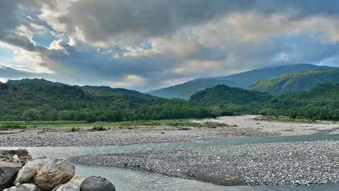 Time lapse clouds over a mountain river Stock Footage 151194534