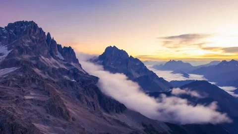 Time Lapse of Clouds Over Mountain Peaks at Sunrise Stock Footage 312112083