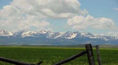 Time-lapse of clouds over mountains and a field in Montana, USA Stock Footage 29672344