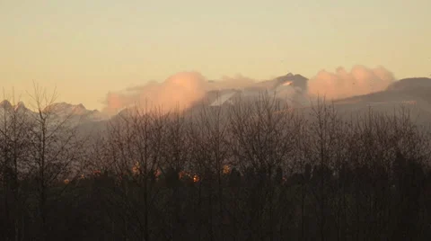 Time Lapse - Clouds over the mountains at sunset Stock Footage 34544749
