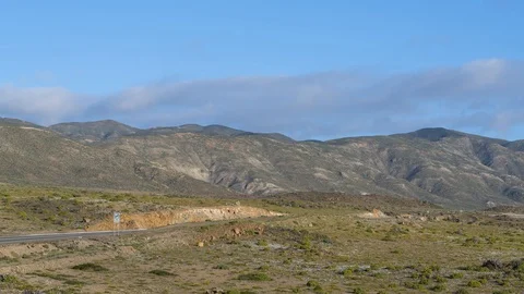 Time lapse of clouds over the mountains Stock Footage 115149680