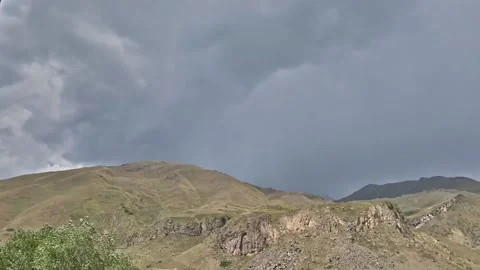 Time lapse clouds over mountains Stock Footage 151009948