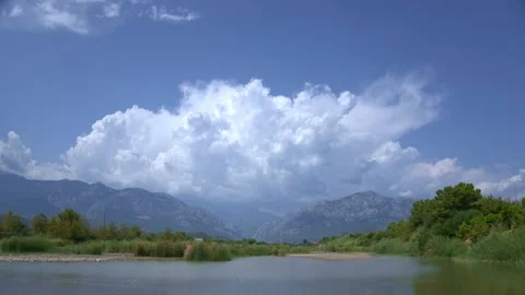 Time lapse of clouds over mountains and lake. Kemer 스톡 동영상 250417051