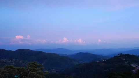 Time lapse of clouds over the mountains at sunset 動画素材 300850214