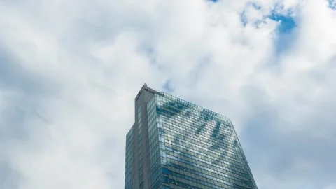 Time Lapse of clouds over office building in Tokyo, Japan Stock Footage 145504191