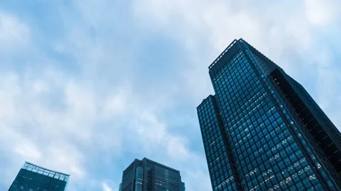 Time Lapse of clouds over office buildings in Tokyo, Japan Stock Footage 145504372
