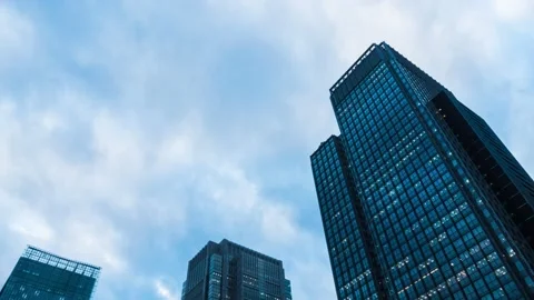 Time Lapse of clouds over office buildings in Tokyo, Japan Stock Footage 145504390