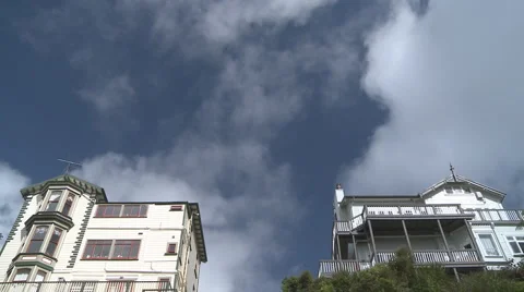 Time lapse clouds over old wooden houses Stock Footage 1034432