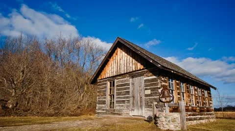 Time lapse of clouds over old schoolhouse Stock Footage 11631246