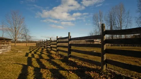Time lapse of clouds over old fence. Stock Footage 11632168