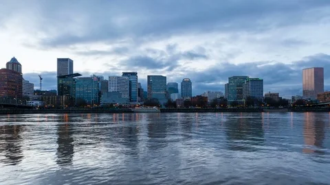 Time lapse of clouds over Portland OR skyline along Willamette River at dusk 4k Stock Footage 72971465