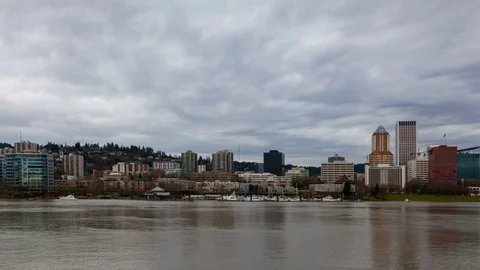Time lapse of clouds over Portland Or skyline along Willamette River 4k uhd Stock Footage 73672220