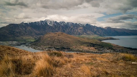 Time lapse of clouds over The Remarkables mountains at Lake Wakatipu New Zealand Stock Footage 121018548