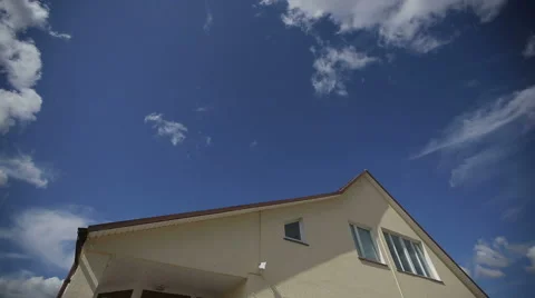 Time lapse of clouds over a roof of the big family house Stock Footage 46197830