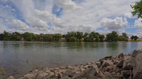 Time Lapse of Clouds Over the Sacramento River Levee Stock Footage 316716235