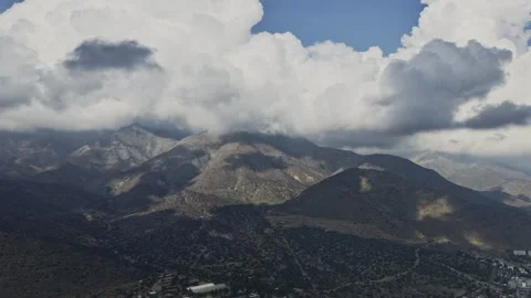 Time Lapse of Clouds Over San Carlos de Apoquindo Foothills Stock Footage 338009375