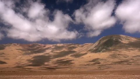 Time lapse of clouds over sand dune. Stock Footage 121622016